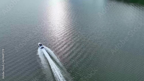 4K drone footage at lake Allatoona . White clouds over the lake in the afternoon. Green trees and calm waters. photo