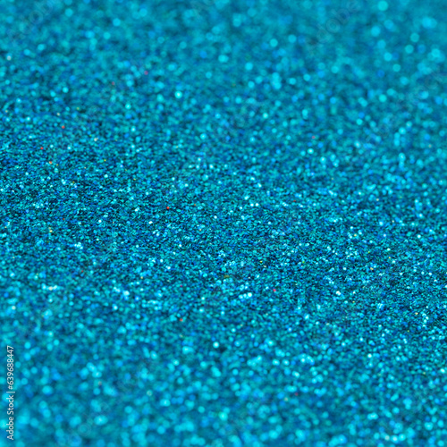 Glittery bright shimmering abstract background made out of shiny crystal colored sequins, perfect as a blue backdrop that sparkles