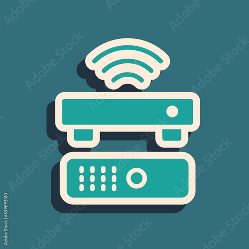 Green Wireless multimedia and TV box receiver and player with remote controller icon isolated on green background. Long shadow style. Vector