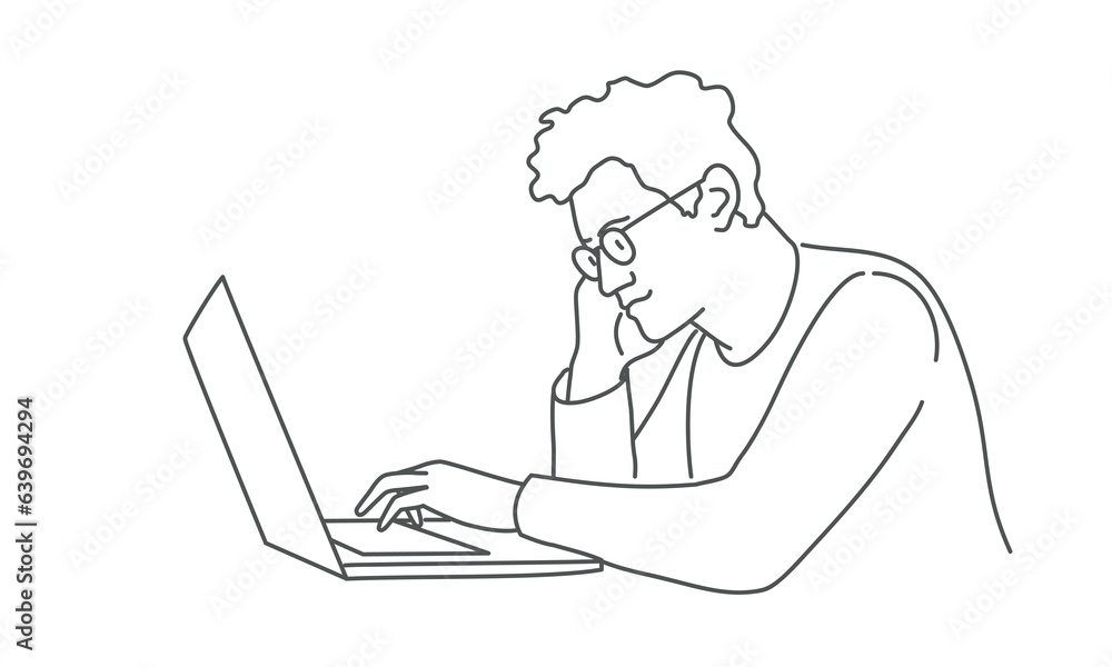 Young guy with glasses works at laptop. Young guy with glasses works at laptop.