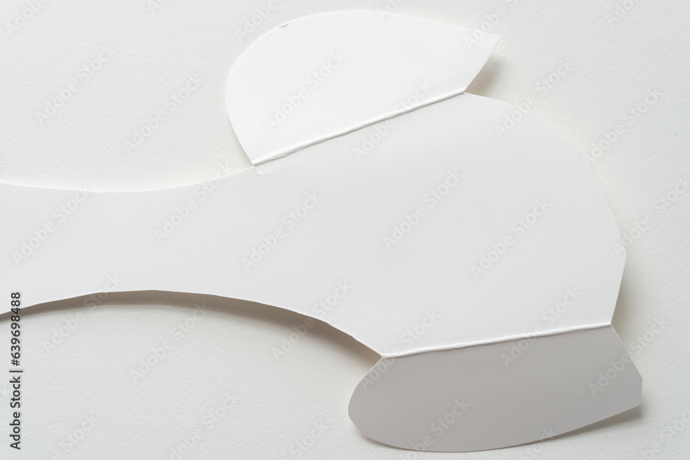 abstract white cardboard shape with rounded and wavy elements and fold lines isolated on a white surface abstract white cardboard shape with rounded and wavy elements and fold lines isolated on a white surface