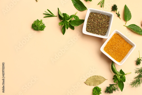 Fototapeta Naklejka Na Ścianę i Meble -  Composition with bowls of spices and herbs on color background