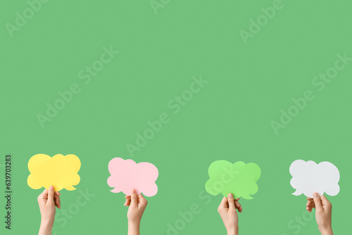 Hands holding colorful spee...
