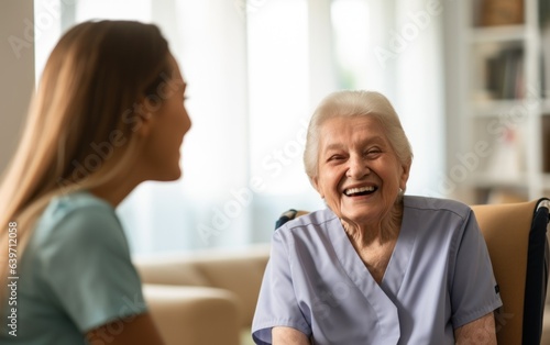 An elderly woman smiling at a nurse in nursing home