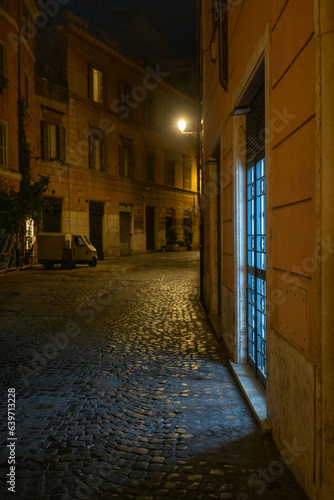 Photography Italian Three Wheeled Van parked at night on ancient Rome street with light pour