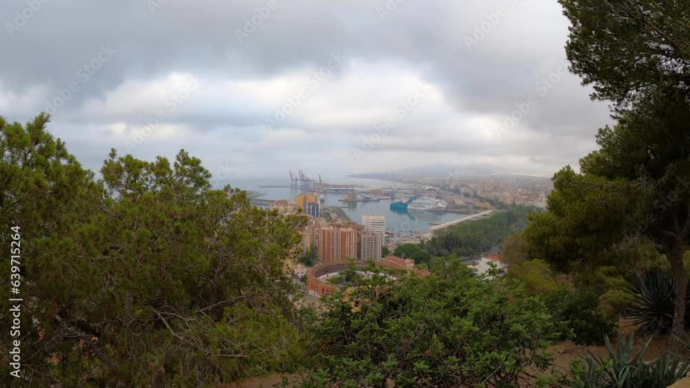 Panoramic aerial view of Malaga in a cloudy summer day in the morning in Malaga, Spain Panoramic aerial view of Malaga in a cloudy summer day in the morning in Malaga, Spain