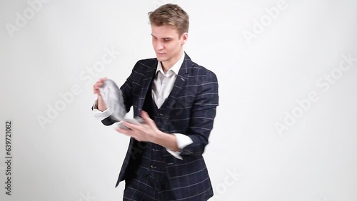 The croupier, the magician, shows a trick Spring with playing cards (flourish, cardistry). Slow Motion
