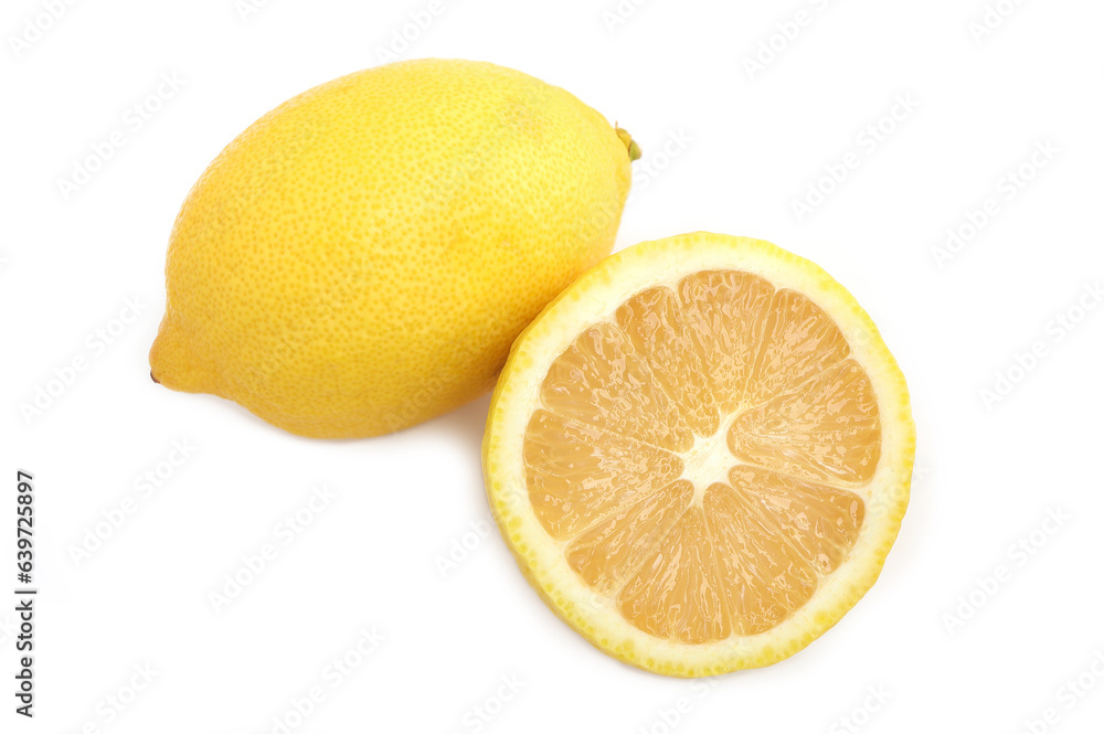 Freshly cut half and whole lemons on white background. Freshly cut half and whole lemons on white background.