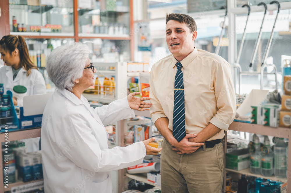 pharmacist is asking about a patient's condition in order to prescribe medication according to the patient's symptoms who come for prescription consultation in a modern pharmacy. pharmacist is asking about a patient's condition in order to prescribe medication according to the patient's symptoms who come for prescription consultation in a modern pharmacy.