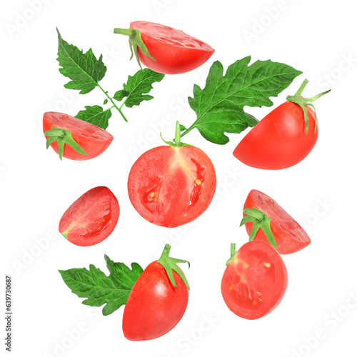 Fototapeta Naklejka Na Ścianę i Meble -  Many fresh ripe tomatoes and green leaves falling on white background