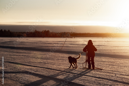On the ice with the dog in the north © Roland