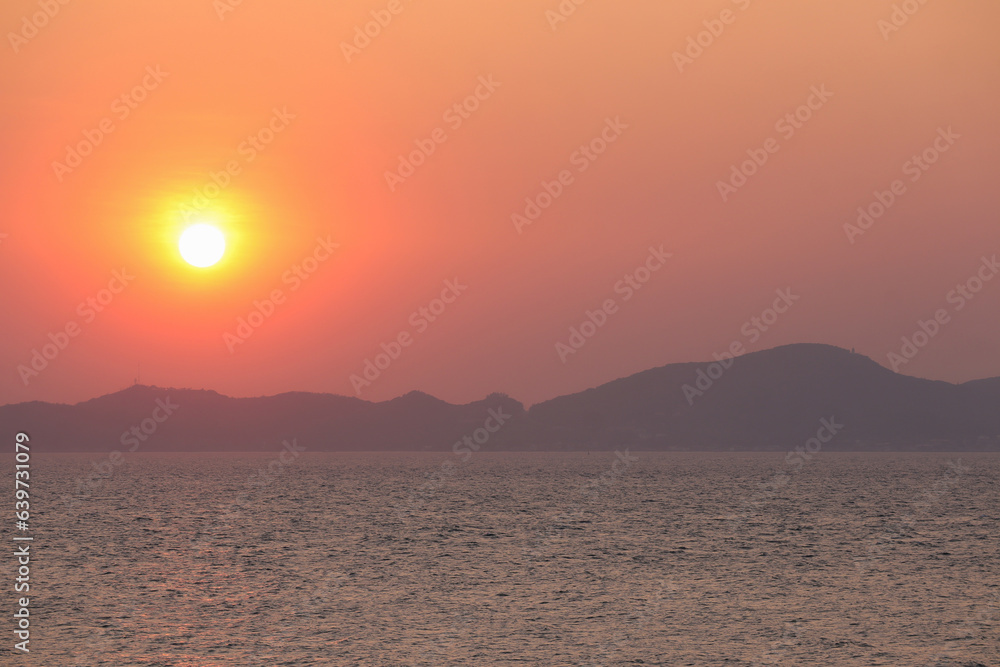 Nature background, Beautiful scenery and Golden sunset of the beach. Reflected sun on a water surface. 