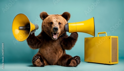 Aggressive marketing with brown bear holding yellow loudspeaker in paw and shouting on light blue background - animal cool boss and business management, concept, creative idea to attract attention photo