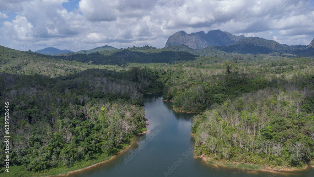 Aerial view of the clear lake with Meratus mountains in the background, the Tanah Bumbu district toll road to Banjar Baru