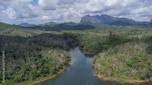 Aerial view of the clear lake with Meratus mountains in the background, the Tanah Bumbu district toll road to Banjar Baru