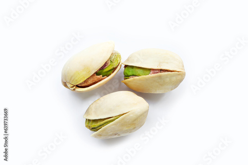 Close up of Pistachios nuts on a white background. raw unsalted pistachios nuts