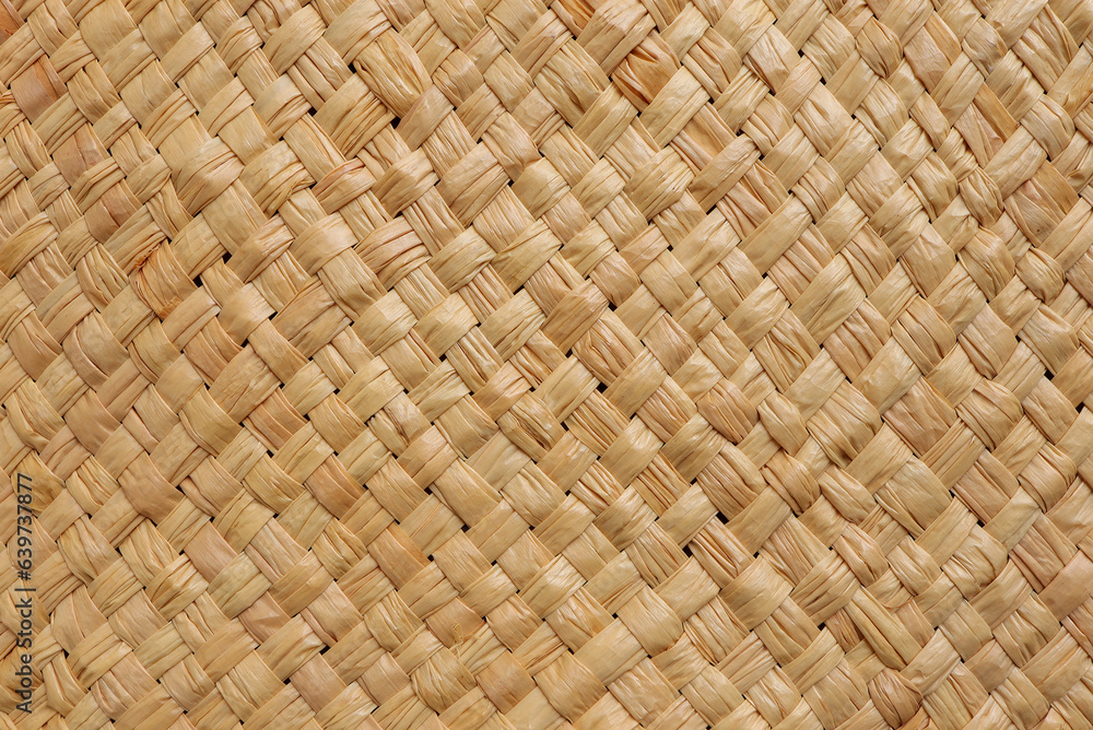 Brown wicker woven bag or straw bag. Woven natural straw texture as background. Wicker woven texture Brown wicker woven bag or straw bag. Woven natural straw texture as background. Wicker woven texture