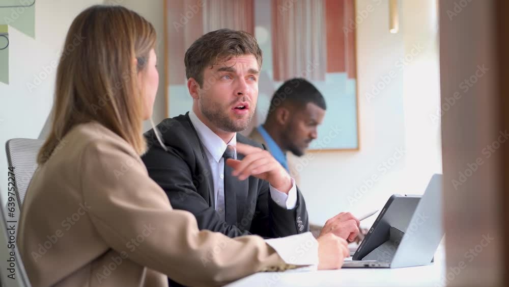 Businessman discussing work with colleagues at company teamwork concept Businessman discussing work with colleagues at company teamwork concept