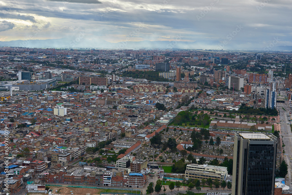 Skyline Brilliance: Basking in sunlight, a panoramic view from Colpatria Tower offers a striking perspective of Bogota's vibrant urban landscape. 