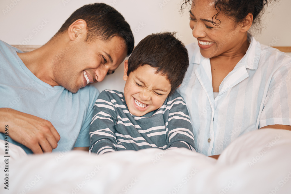 Happy, tickle and funny with family in bedroom for playful, morning and love. Care, support and wake up with parents and boy child laughing in bed at home for weekend, positive and relax together Happy, tickle and funny with family in bedroom for playful, morning and love. Care, support and wake up with parents and boy child laughing in bed at home for weekend, positive and relax together