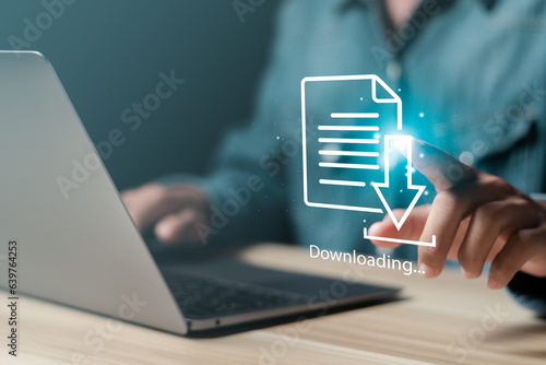 Obraz na plátně Businessman downloading data or documents to computer files