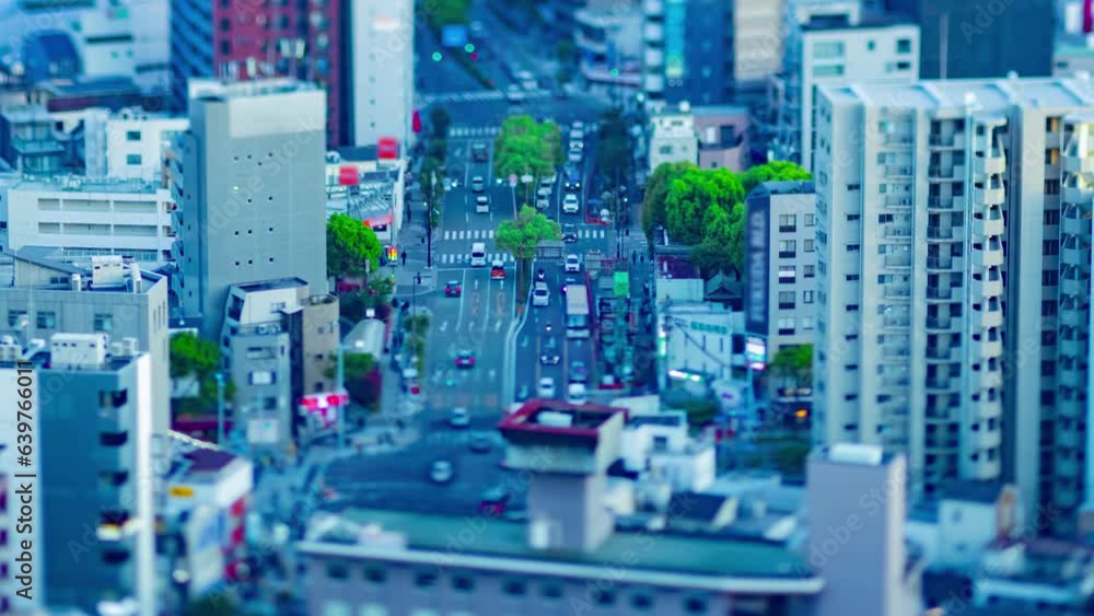 A dusk timelapse of high angle cityscape at the urban street in Osaka zoom A dusk timelapse of high angle cityscape at the urban street in Osaka zoom