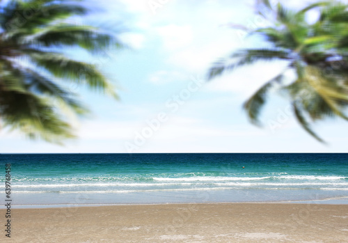 Fototapeta Naklejka Na Ścianę i Meble -  blurred palm tree on tropical beach with blue sky and white clouds background. copy space of summer vacation and business travel concept design