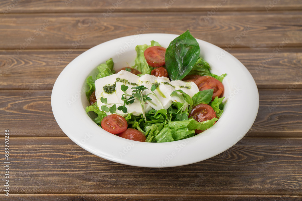 Green vegan salad from green leaves mix and vegetables. Green vegan salad from green leaves mix and vegetables.