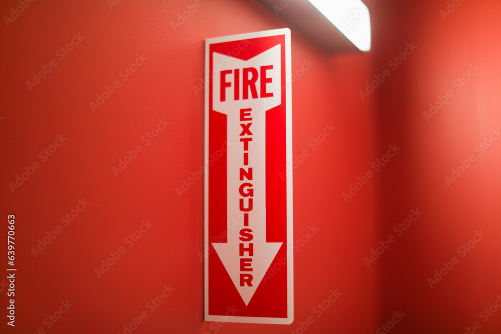 Fire extinguisher and sign depicting safety, urgency, preparedness, red ...
