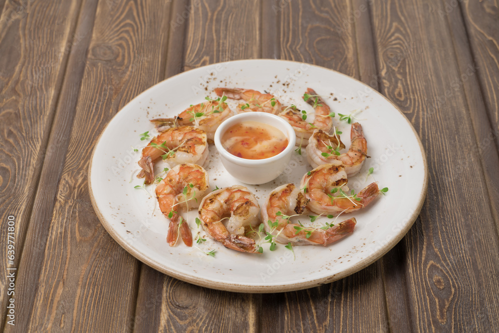 Stir fried shrimp with thai basil on grey plate Stir fried shrimp with thai basil on grey plate