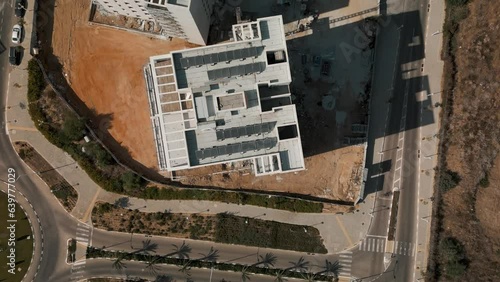 The drone is flying over a construction object