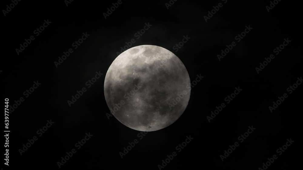 Black moon with clouds being blown by winds Black moon with clouds being blown by winds