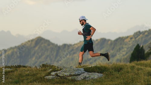 Young man runs in the mountains