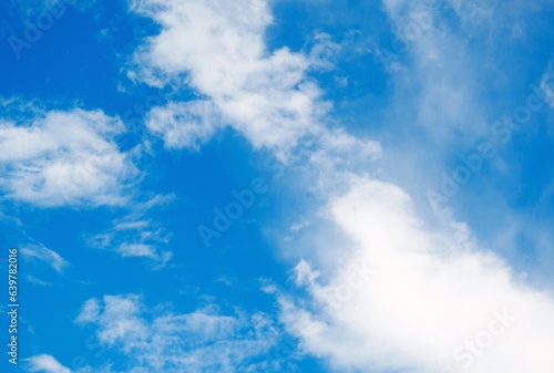 Blue sky background with white clouds. Natural sky background with white clouds.