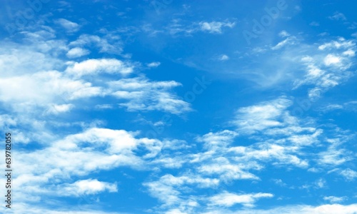 Fototapeta Naklejka Na Ścianę i Meble -  Blue sky background with tiny clouds. Abstract background of blue sky with tiny clouds.