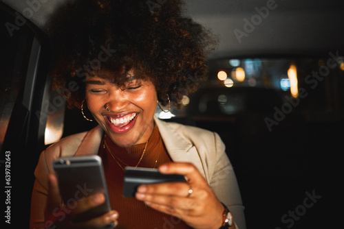 Black woman, smartphone and credit card, travel and online shopping in car at night, happiness and payment. Smile, e commerce and internet banking, app and transportation with account and fintech