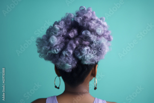 Back of head of woman with pastel blue and purple dyed hair. 