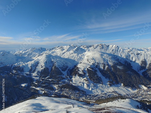 Mountains, snow and nature with landscape and village, travel and adventure with winter, Earth and scenery. Arctic, alps and mockup space, cold environment and land, hiking path and buildings