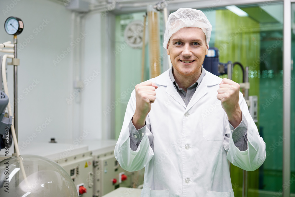 scientist feeling happy and doing winner gesture in testing lab scientist feeling happy and doing winner gesture in testing lab