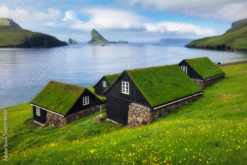 Fényképezés Bour village in Faroe islands - Ocean and mountain landscape