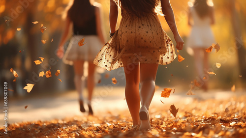 cheerful bachelorette party in an autumn park in leaf fall, girl in a light skirt against the background of autumn falling leaves and friends vacation in autumn