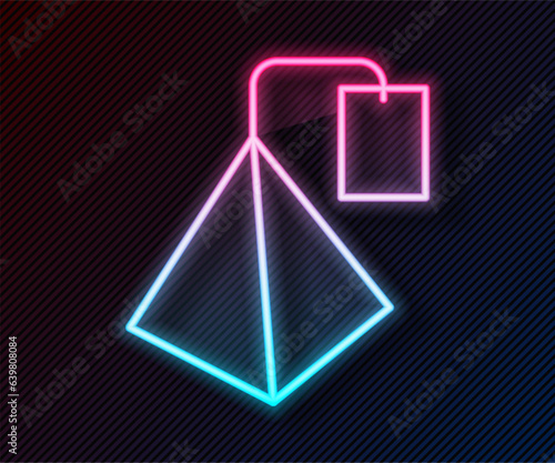 Glowing neon line Tea bag icon isolated on black background. Vector