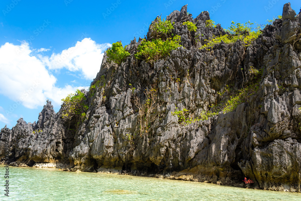 Clear turquoise water and rocks in the tropical big lagoon, El Nido, Philippines