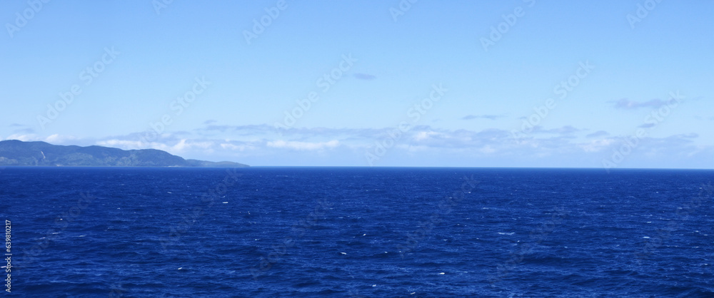 Obraz premium High angle view of coastline and hills calm sea