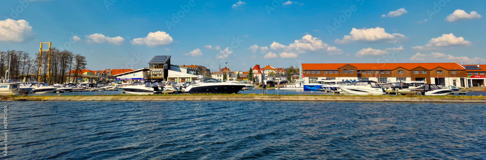 Gizycko, Poland April 20, 2023: panoramic view of a marina and pier in Gizycko on Lake Niegocin, Masuria, Poland.