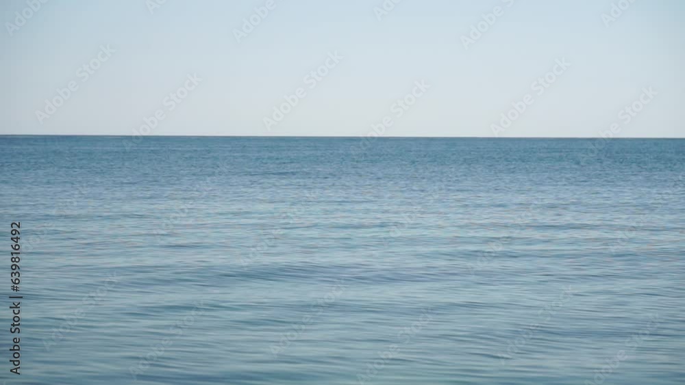 Aerial panoramic view of beautiful sunset above sea. Beautiful seascape. Sun glare, small waves on the water surface. Evening. Horizon. Nobody. No people. Never-ending beauty of nature. Aerial panoramic view of beautiful sunset above sea. Beautiful seascape. Sun glare, small waves on the water surface. Evening. Horizon. Nobody. No people. Never-ending beauty of nature.