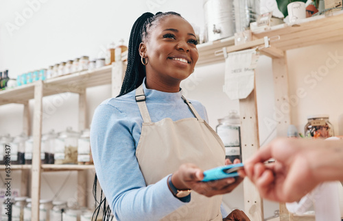 Sustainable shop  woman cashier and credit card with store and electronic transaction with small business. Worker smile  entrepreneur and happy African person with retail employee and shopping pay