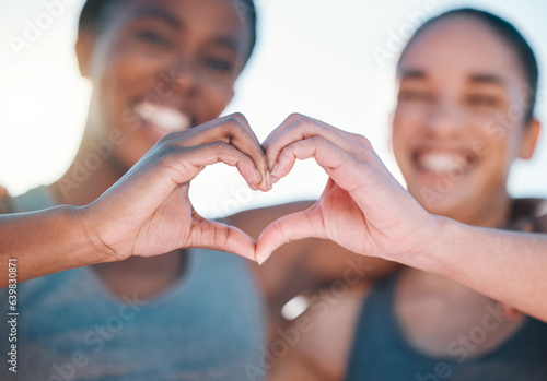 Friends, fitness and closeup, women with heart hands and emoji, wellness and health, support and love sign outdoor. Happiness, care and exercise, cardio and sports, healthy and workout together