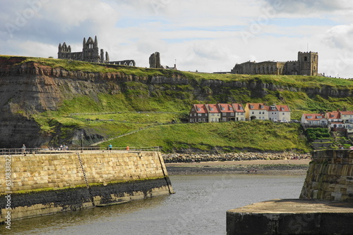 Obraz na płótnie Whitby – with the 13 century Abbey  and the Church of Saint Mary on the cliff overlooking the town,  North Yorkshire, England - famously linked by Bram Stoker's novel Dracula