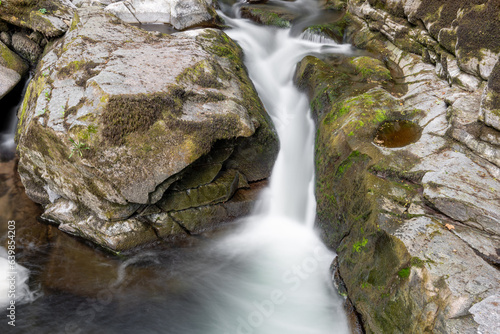 Long exposure of a waterfall on the East Lyn river at Watersmeet in Exmoor National Park